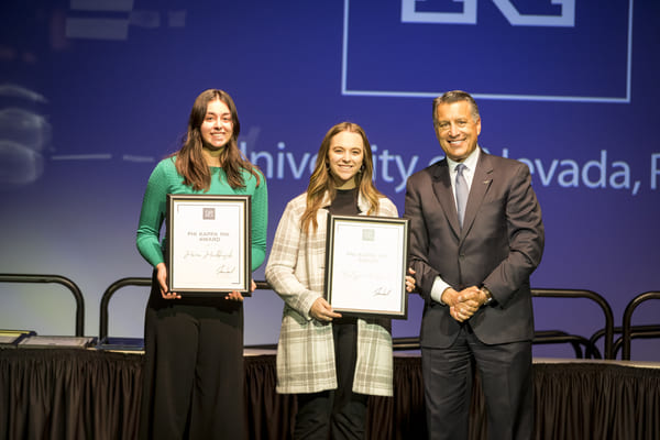 Phi Kappa Phi Award award winners Kaitlynn Petrovich; Hana Hackbusch with President Sandoval